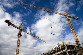 Cranes on a building side