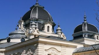 top of old mansion with domes at sky, hungary, budapest