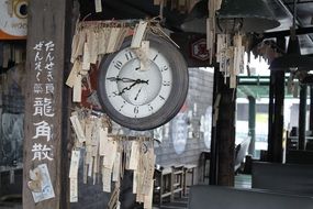 old hanging clock in train station