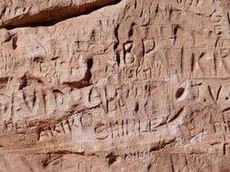 lettering on red rock, usa, utah, arizona, monument valley