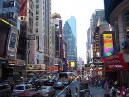 people and traffic on a busy street, usa, manhattan, new york city