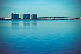 tranquil landscape with bridge above calm water, usa, alabama