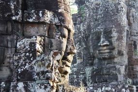 ancient stone carving of bayon temple, cambodia