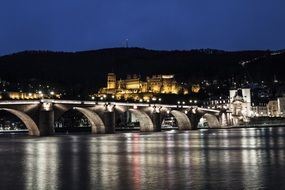 illuminated bridge and heidelberg castle at night, germany, neckar