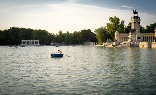 couple in boat Lake building scene