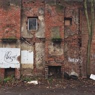 ruined brick wall of abandoned building