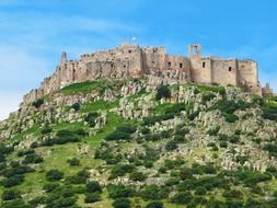 ruined medieval castle on hilltop, spain