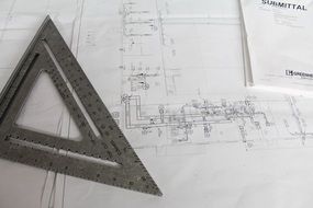 drawing building plans with a pencil and a ruler