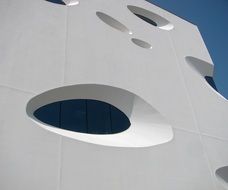 elliptical windows on white facade, czech, brno