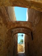 lanterns on walls in old alley