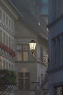 antique lantern on wall in old city at dusk, switzerland, freiburg