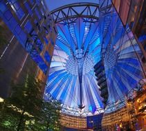 colorful illuminated sony center at night, germany, berlin