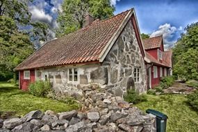 traditional sweden stone house and fence in village