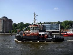 tug on elbe river at port, germany, hamburg