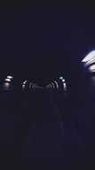 lights in long dark tunnel