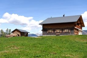 hut on the green meadow