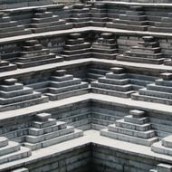 ancient grey stone Pushkarani step well, india, Hampi
