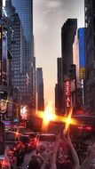 people taking photo of sunset on time square, usa, manhattan, new york city