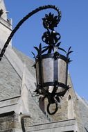 beautiful wrought iron lantern on facade of bryn mawr college at blue sky background, usa, pennsylvania