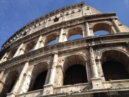 colosseum facade with arched windows, italy, rome