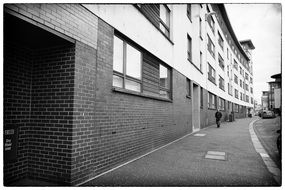 man walking on street in city