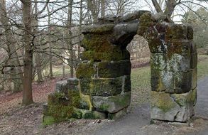 ruin of old stone gateway in park