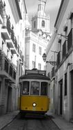 yellow tram on narrow street, portugal, lisbon