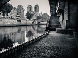 Front view of Notre Dame cathedral from sidewalk at water, france, paris