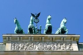 quadriga atop of brandenburg gate at sky, front view, germany, berlin