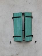 window with closed green shutters