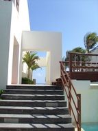 grey stone stairs at white hotel