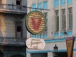 retro street sign at hotel on facade, cuba, havana