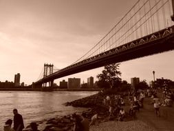 black and white image of the sunset over the Brooklyn Bridge of New York city