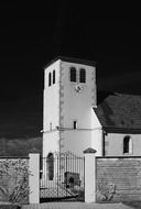 old church building behind fence, france, abergement la ronce