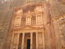 ancient facade with columns carved in rock, jordan, petra