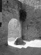 stone at old arched gateway, spain, catalonia