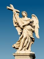 angel with cross at sky, sculpture on sant'angelo bridge, italy, rome