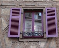 window with purple shutters, france, colmar