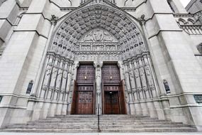 beautiful doorway of neogothic Cathedral of St. John the Divine, usa, nyc