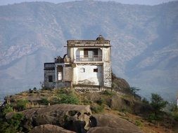 old ruined building in mountain landscape, india, mount abu