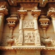 ancient stone carving on wall of hindu temple, india, hampi