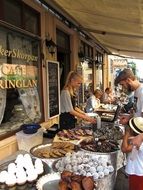 people at pastry on table of street cafe, sweden, gothenburg