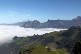 fog in mountain valley at morning, switzerland