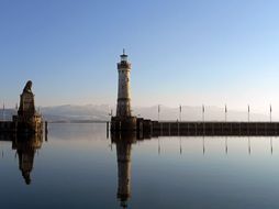 lighthouse with clock and Bavarian Lion sculpture on lake constance, germany, lindau