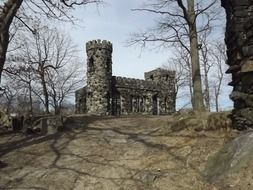 medieval fort with tower among bare trees