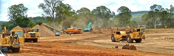 Powerful road construction equipment at earthwork