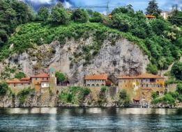 santa caterina del sasso, medieval Roman Catholic monastery on rock at water, italy, leggiuno