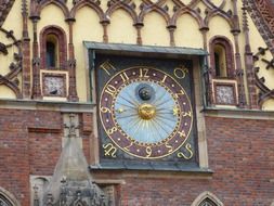 antique clock on town hall, poland, wroclaw