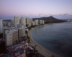 modern city on coast at dusk, usa, hawaii, honolulu, waikiki beach