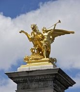 golden statue on Pont Alexandre III Bridge over the River Seine at sky, france, paris